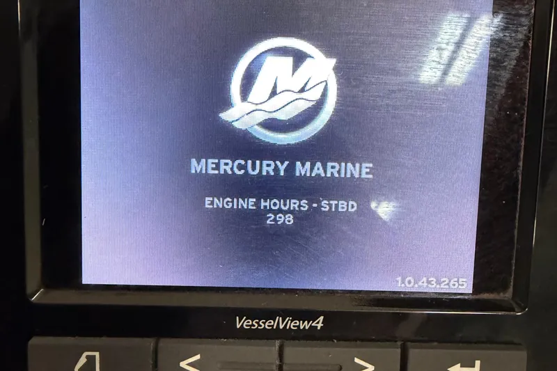 Slide: The Image of Display screen showing Mercury Marine engine hours at 298 on a 2014 Monterey 320 Sport Yacht. - 18