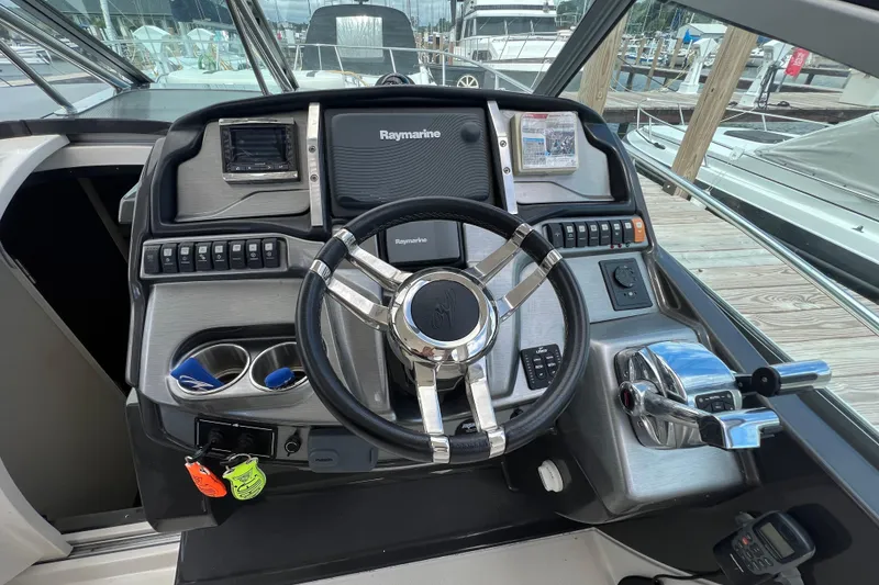 Slide: The Image of Helm of 2014 Monterey 320 Sport Yacht with Raymarine electronics and modern controls. - 7