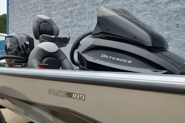 Slide: The Image of 2026 Vexus 189D boat with sleek design and comfortable seating, featuring "Defender" branding. - 6