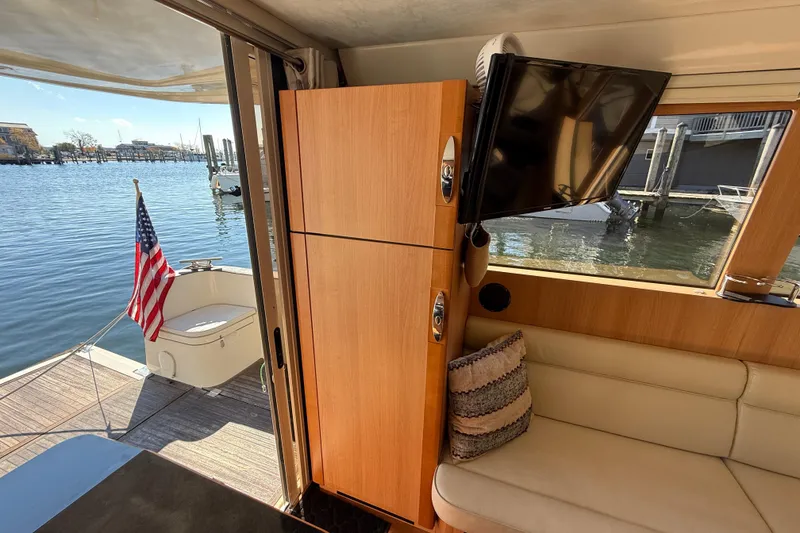 Slide: The Image of Interior of 2013 Greenline 33 yacht with TV, seating, and water view. - 29
