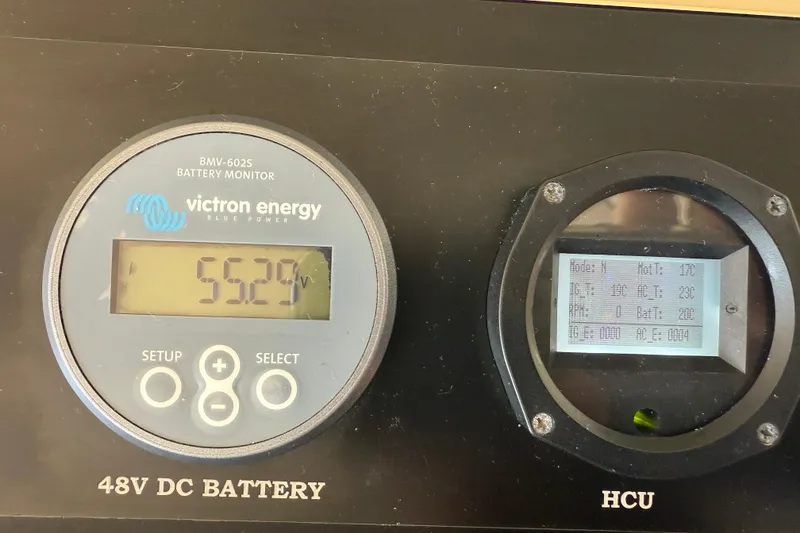 Slide: The Image of Battery monitor display on 2013 Greenline 33, showing 55.29V and additional metrics. - 47