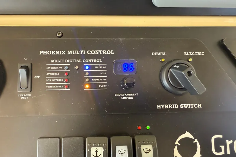 Slide: The Image of Control panel of a 2013 Greenline 33 with Phoenix Multi Control and hybrid switch. - 48