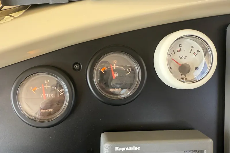 Slide: The Image of Dashboard gauges of a 2013 Greenline 33 boat, displaying water and voltage levels. - 51