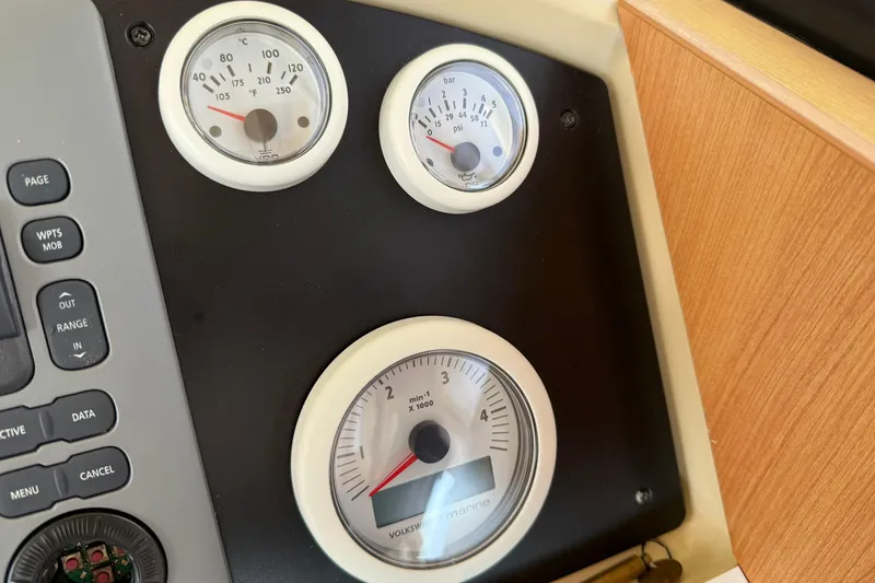 Slide: The Image of Instrument panel of a 2013 Greenline 33 boat with gauges and controls. - 52