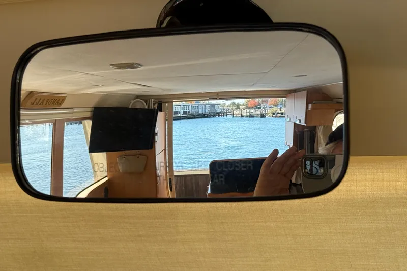 Slide: The Image of Reflection inside a 2013 Greenline 33 boat, showing interior and water view. - 57