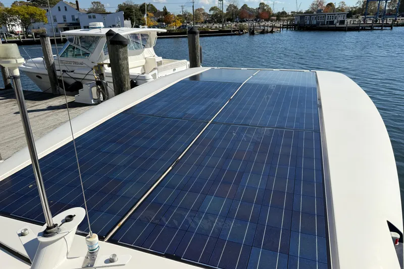 Slide: The Image of Solar panels on a 2013 Greenline 33 boat docked at a marina. - 6
