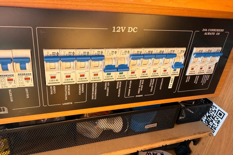 Slide: The Image of Electrical panel with labeled circuit breakers on a 2013 Greenline 33 boat, featuring 12V DC system. - 64