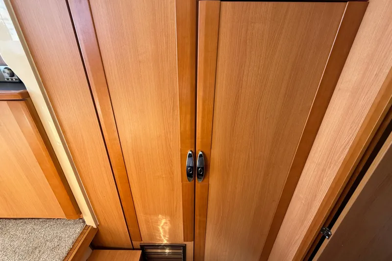 Slide: The Image of Wooden interior of 2013 Greenline 33 yacht, featuring sleek cabinetry and modern design. - 68