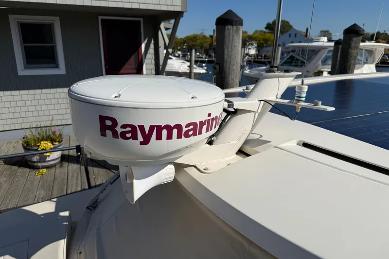 Slide: The Image of Raymarine radar on 2013 Greenline 33 boat docked near a wooden pier. - 7