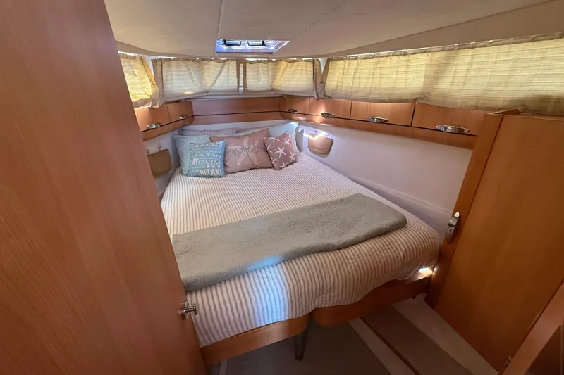 Slide: The Image of Cozy cabin interior of 2013 Greenline 33 yacht with bed and wooden furnishings. - 70
