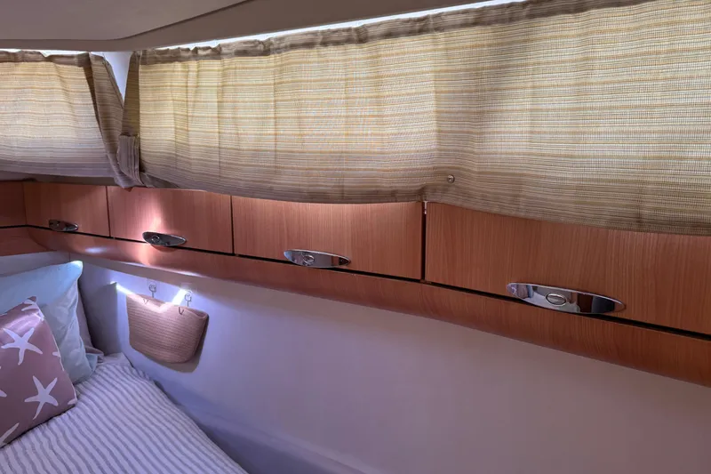 Slide: The Image of Cozy cabin interior of 2013 Greenline 33 yacht with wooden cabinets and soft lighting. - 78