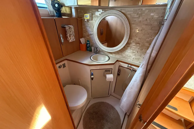 Slide: The Image of Compact bathroom in 2013 Greenline 33 yacht with round mirror and modern fixtures. - 80
