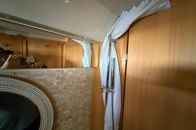 Slide: The Image of Interior of 2013 Greenline 33 yacht bathroom with wood paneling and shower. - 82
