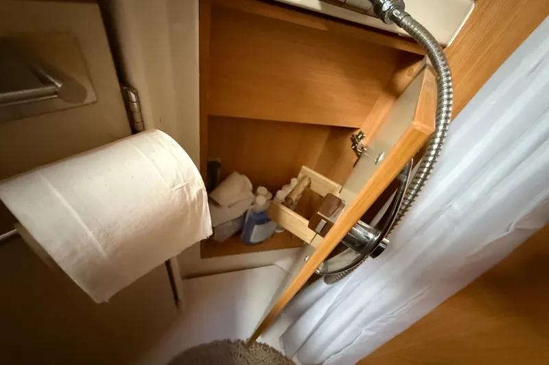 Slide: The Image of Interior of 2013 Greenline 33 yacht bathroom with toilet paper and storage shelves. - 83