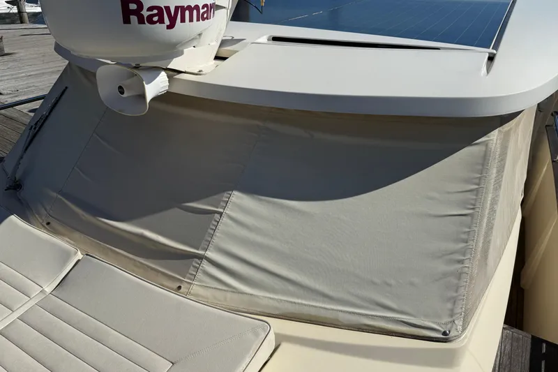 Slide: The Image of 2013 Greenline 33 boat with Raymarine equipment and solar panel, docked at a marina. - 9