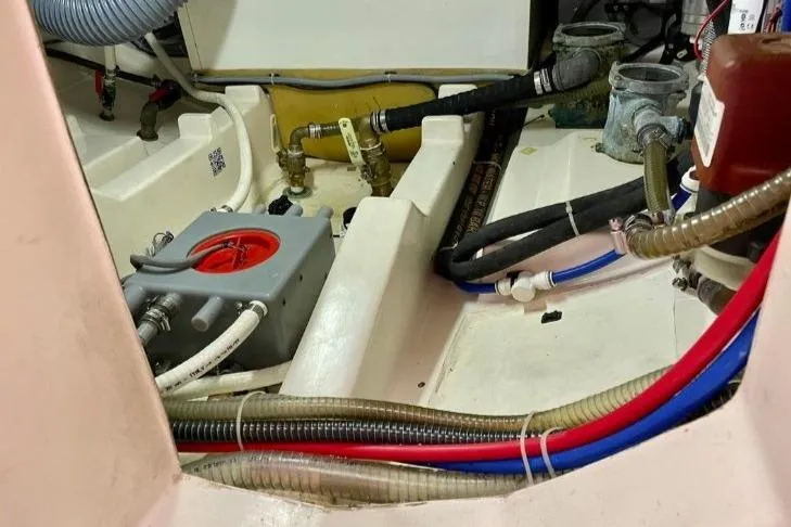 Slide: The Image of Engine room of 2013 Greenline 33 boat with visible hoses and components. - 96