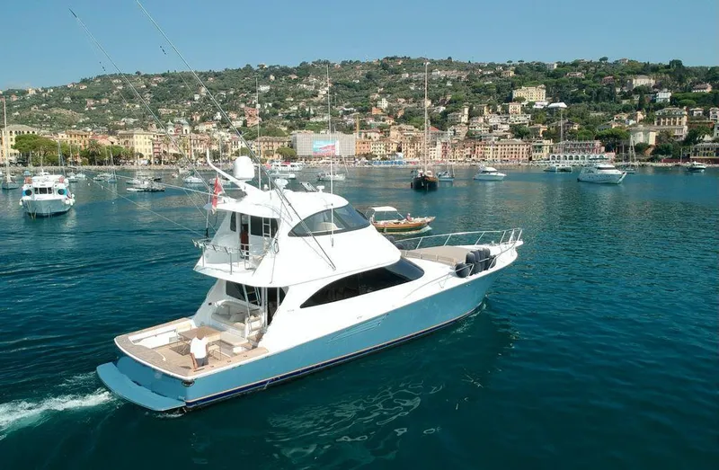 Slide: The Image of 2018 Viking 62 Enclosed Bridge yacht cruising in scenic harbor. - 13