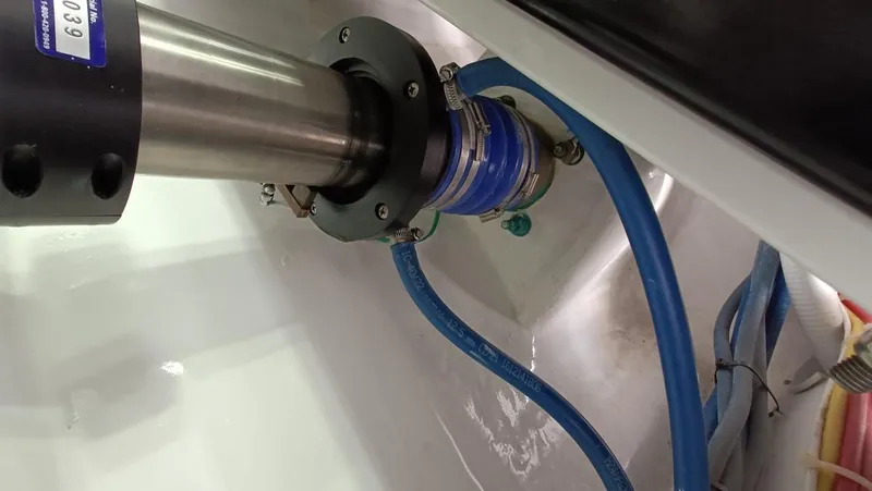 Slide: The Image of Engine room detail of 2018 Viking 62 Enclosed Bridge with visible hoses and fittings. - 24