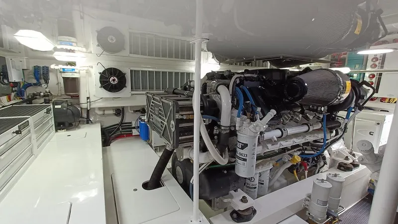Slide: The Image of Engine room of 2018 Viking 62 Enclosed Bridge yacht, showcasing machinery and equipment. - 29