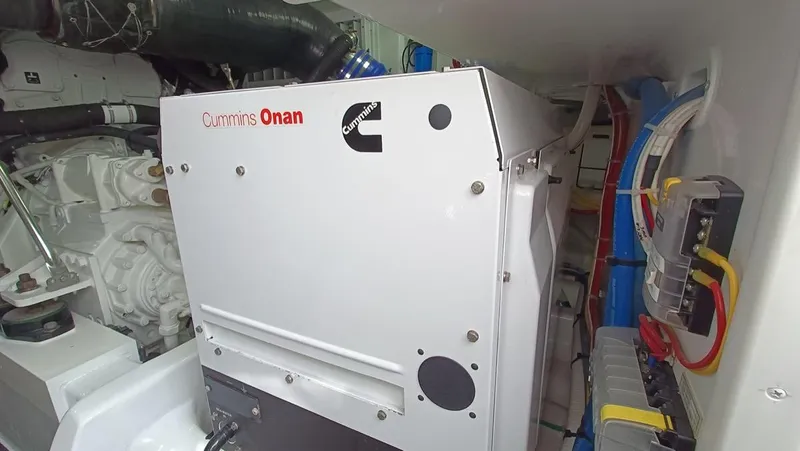 Slide: The Image of Cummins Onan generator in 2018 Viking 62 Enclosed Bridge engine room. - 35