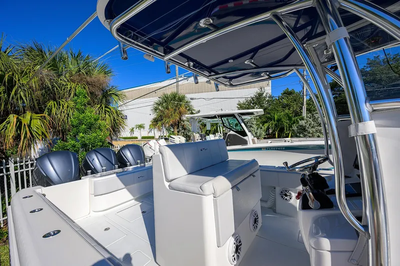 Slide: The Image of 2021 Contender 35 ST boat interior with triple engines, sleek seating, and modern design. - 18