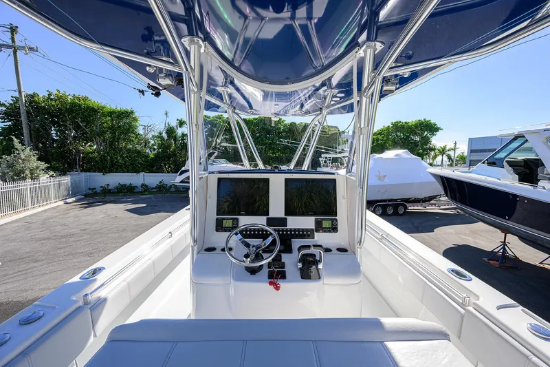 Slide: The Image of 2021 Contender 35 ST boat cockpit with modern controls and dual screens. - 20