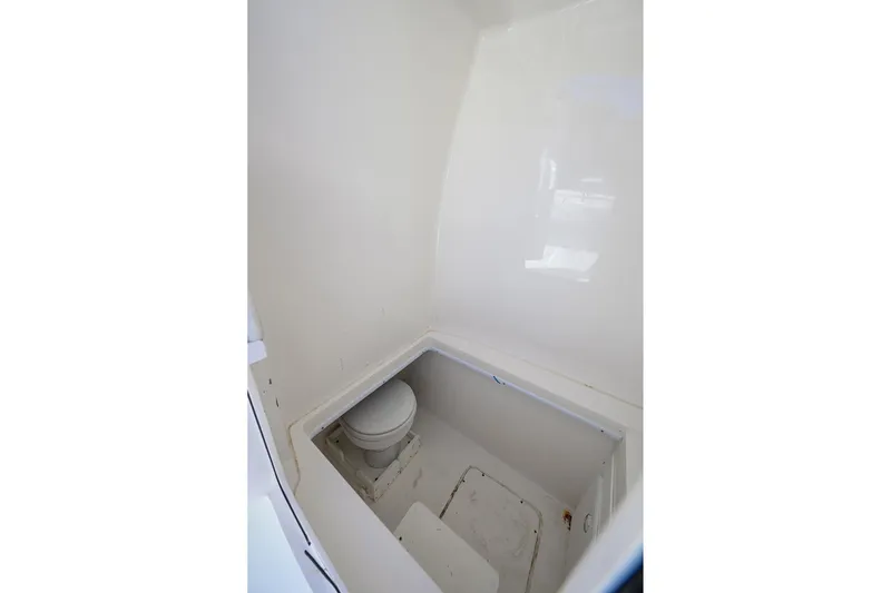 Slide: The Image of 2021 Contender 35 ST boat interior with compact marine toilet. - 37