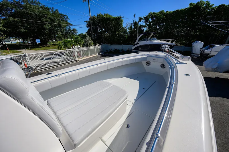 Slide: The Image of 2021 Contender 35 ST boat with sleek white seating and spacious deck. - 9