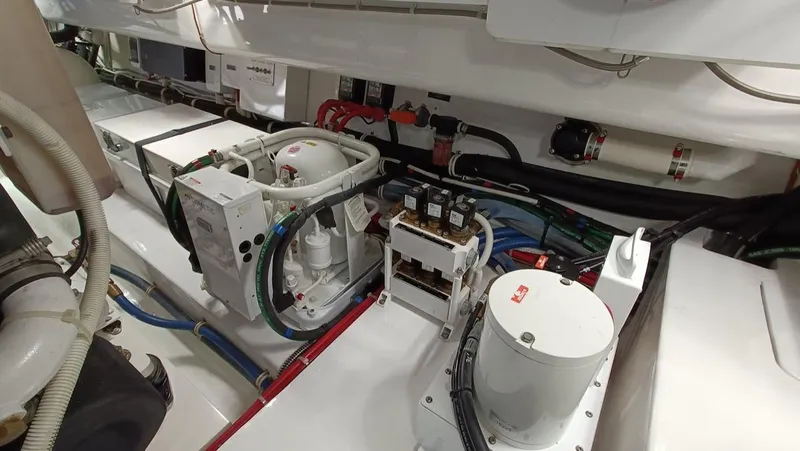 Slide: The Image of Engine room of 2018 Viking 62 Enclosed Bridge yacht with complex machinery and wiring. - 28