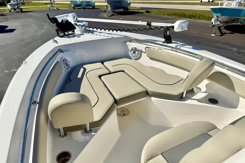 Slide: The Image of 2025 Key West 203 FS boat interior with beige seating and modern features. - 11