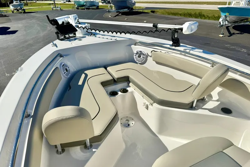 Slide: The Image of 2025 Key West 203 FS boat interior with beige seating and modern equipment. - 13