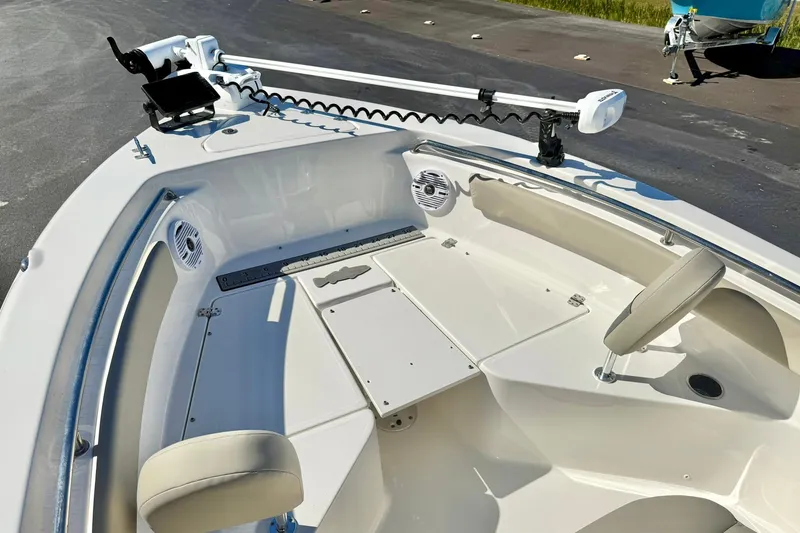 Slide: The Image of 2025 Key West 203 FS boat interior with seating and trolling motor. - 14