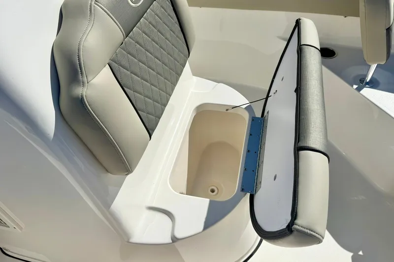 Slide: The Image of 2025 Key West 203 FS boat seat with storage compartment open. - 21