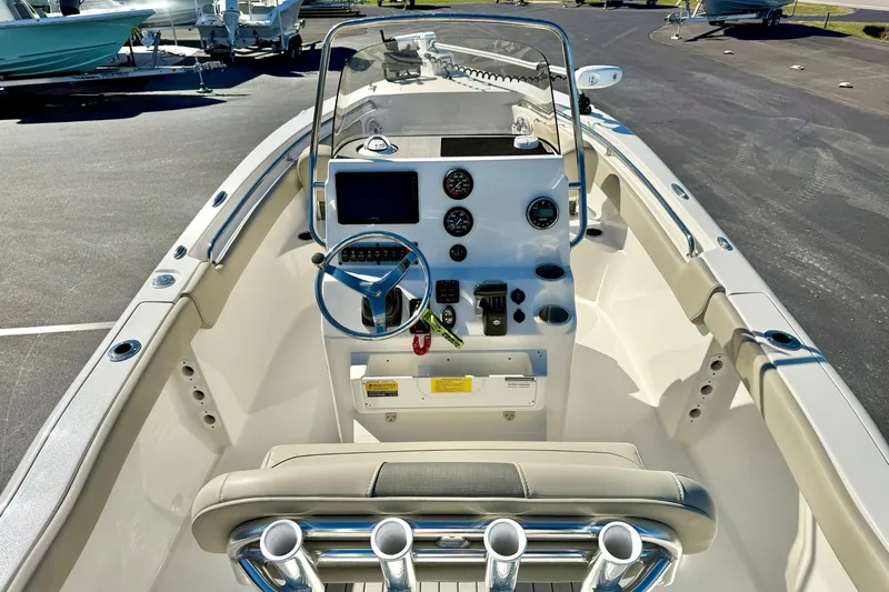 Slide: The Image of 2025 Key West 203 FS boat interior with steering console and seating. - 27