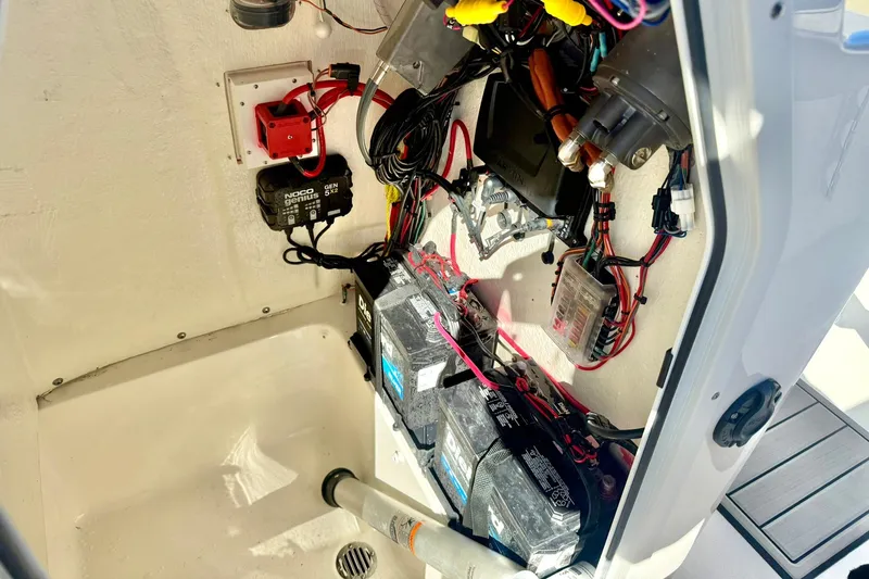 Slide: The Image of 2025 Key West 203 FS boat electrical system with batteries and wiring. - 29