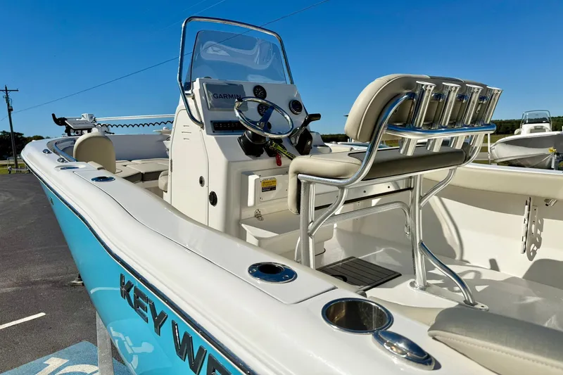 Slide: The Image of 2025 Key West 203 FS boat interior with steering console and seating, featuring a Garmin system. - 30