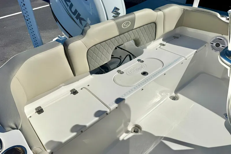 Slide: The Image of 2025 Key West 203 FS boat interior with cushioned seating and storage compartments. - 32
