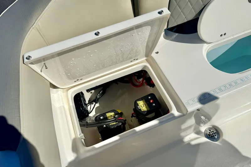 Slide: The Image of Open hatch on 2025 Key West 203 FS boat showing battery compartment. - 34