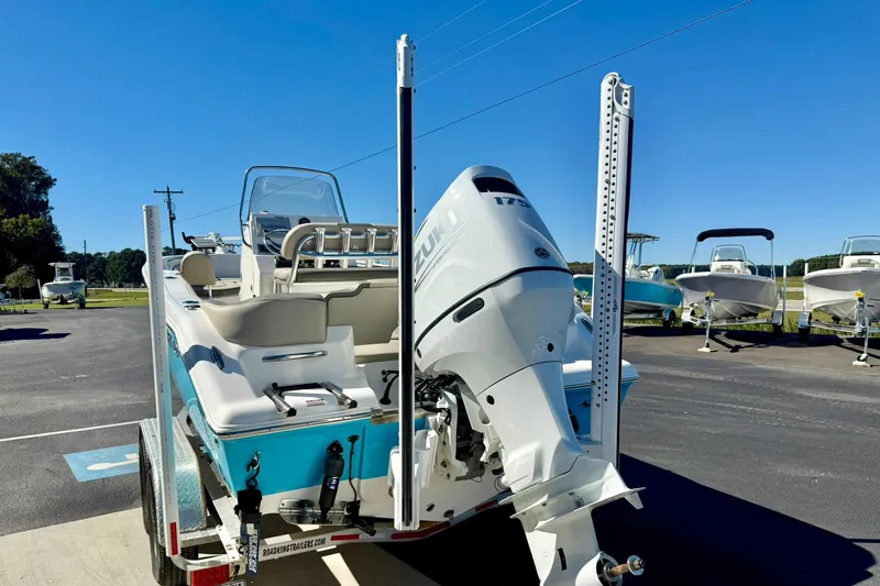 Slide: The Image of 2025 Key West 203 FS boat with Suzuki outboard motor on a trailer. - 37
