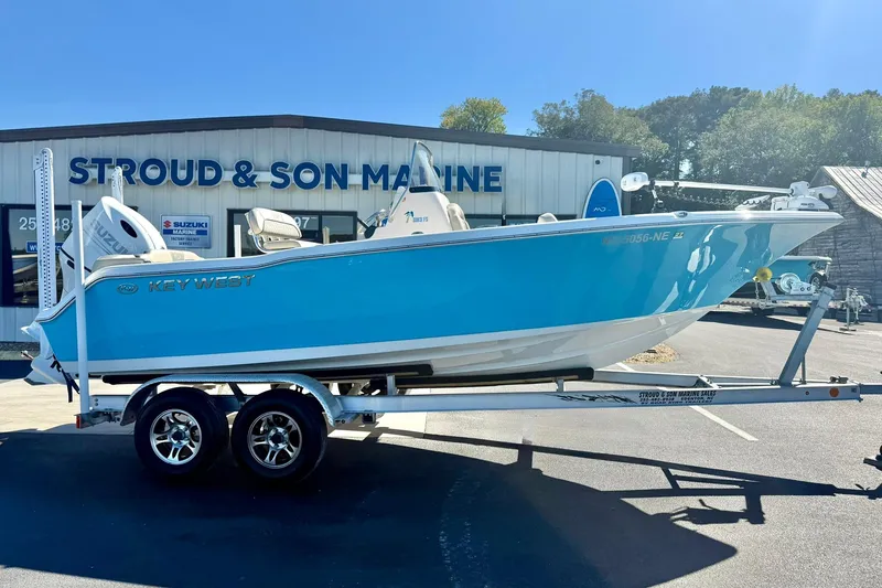 Slide: The Image of 2025 Key West 203 FS boat on trailer at Stroud & Son Marine dealership. - 7