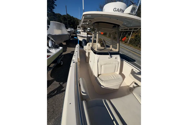 Slide: The Image of 2017 Grady-White Fisherman 257 boat, center console, parked outdoors, sunny day. - 11
