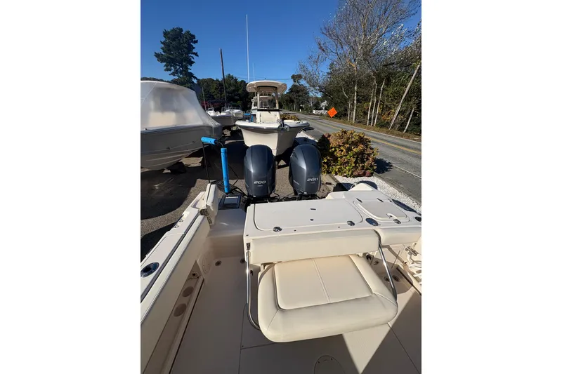 Slide: The Image of 2017 Grady-White Fisherman 257 boat with dual 200 horsepower engines, parked outdoors. - 17