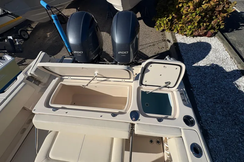 Slide: The Image of 2017 Grady-White Fisherman 257 boat with dual 200 horsepower engines and open storage compartments. - 19