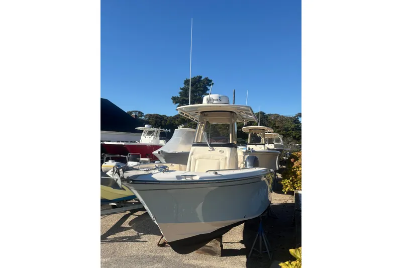 Slide: The Image of 2017 Grady-White Fisherman 257 boat displayed outdoors under clear blue sky. - 3