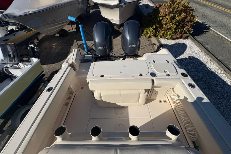 Slide: The Image of 2017 Grady-White Fisherman 257 boat with dual 200 horsepower engines, docked outdoors. - 7