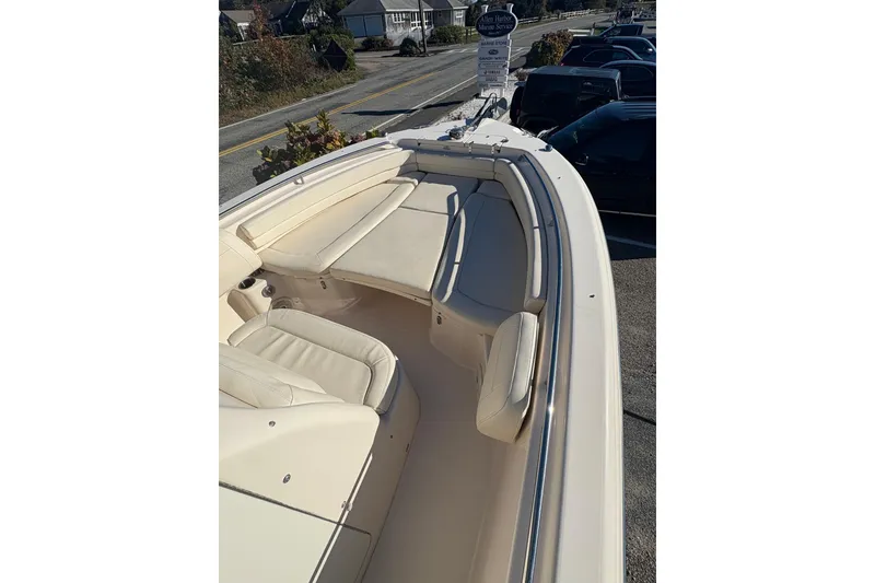 Slide: The Image of 2017 Grady-White Fisherman 257 boat interior with cushioned seating and sleek design. - 8