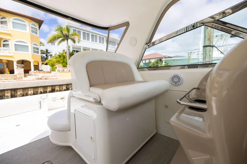 Slide: The Image of Interior of 2000 Sea Ray 370 Express Cruiser with plush seating and waterfront view. - 15