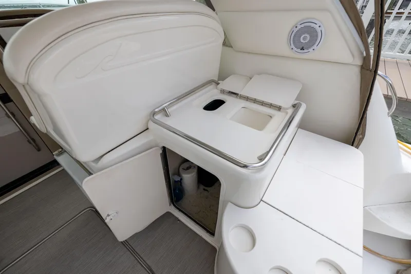 Slide: The Image of 2000 Sea Ray 370 Express Cruiser interior with storage and sink area. - 30