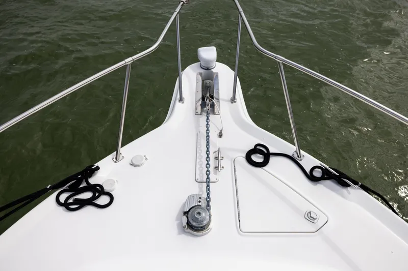 Slide: The Image of Bow of 2000 Sea Ray 370 Express Cruiser with anchor chain and ropes. - 36