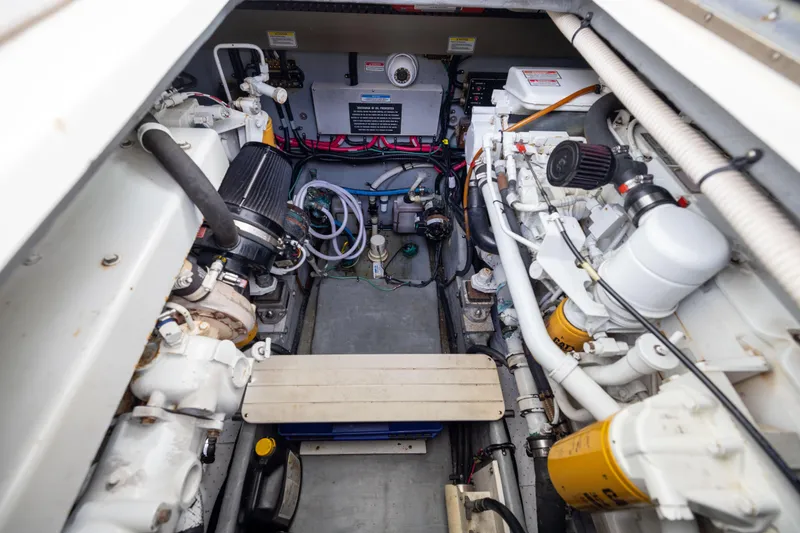 Slide: The Image of Engine room of 2000 Sea Ray 370 Express Cruiser, showcasing mechanical components and systems. - 39